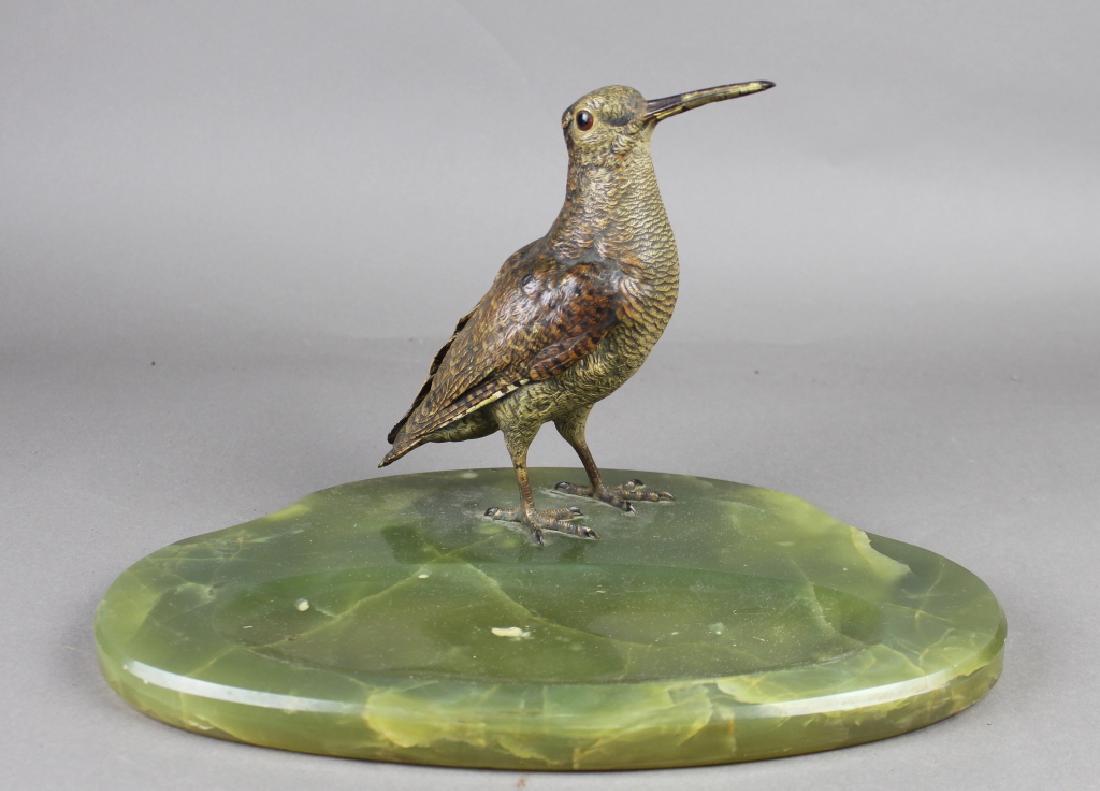 Austrian Cold Painted Bronze Snipe on Tray: Austrian cold painted bronze snipe on green onyx card receiver. Bird has natural coloring with glass eyes, standing 7.5" x 9.5" on a 14" x 9" oval tray, marked "Made in Austria", small ding in center 