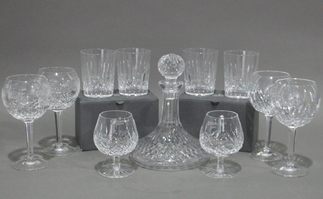 Waterford Crystal Group: Waterford crystal group: 8" "Logan" 10 ounce highball glasses (4 never unpacked), "Lismore" captain's decanter and two brandy snifters, two "Happiness" tall balloon toasting goblets, and two "Love" ta