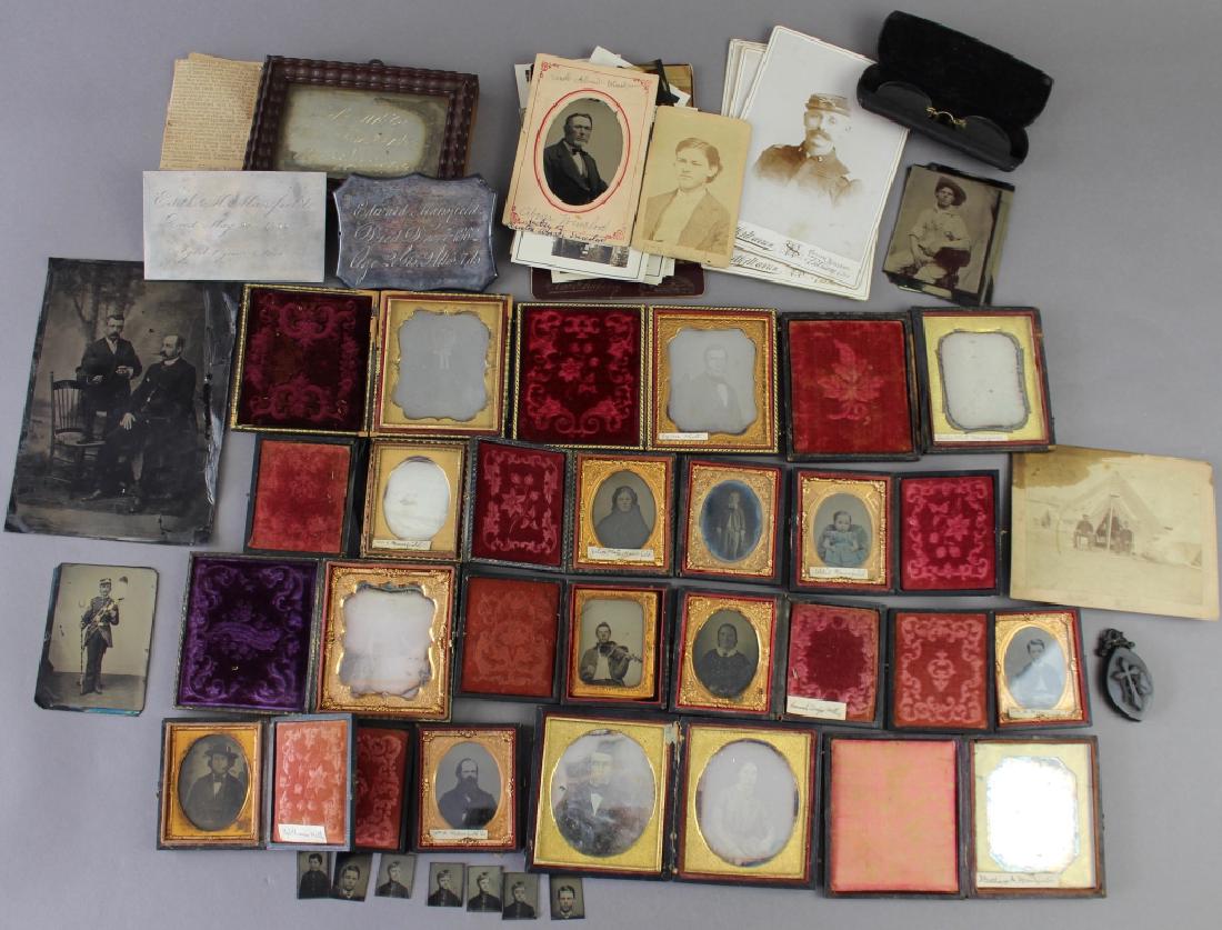 Family Daguerreotypes from Putnam, CT. (Tintypes): Large group of family daguerreotypes from Putnam, CT. Most are identified. Accompanied by other photos from mid 19th century and Civil War period, as found condition.15 framed pieces and more without.