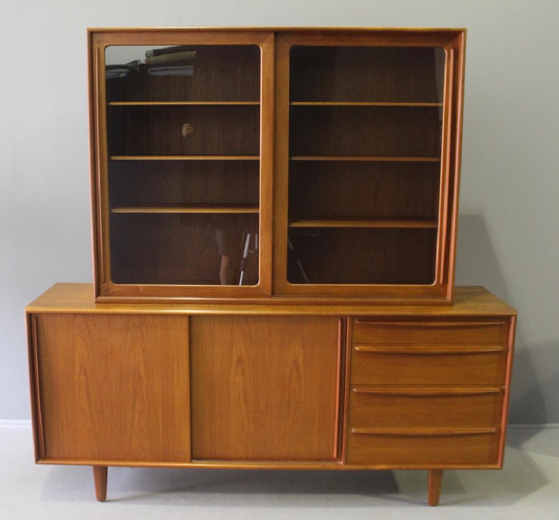 Falster Mid-Century Modern Danish Sideboard: Falster mid-century modern Danish teak sideboard with china hutch top. Four drawers on right side, 2 sliding doors revealing center storage, the 3 silver felt lined drawers on left. Top has 2 sliding 