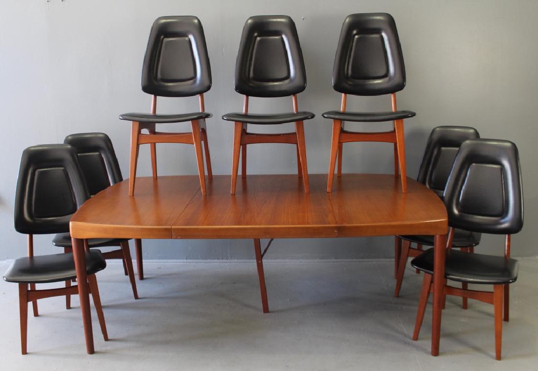 Bramin Danish Mid-Century Table & 8 Chairs: Danish made teak Mid-century modern dining table with 8 matching chairs. Table is labeled "Bramin-Made in Denmark", and dated May 23, 1969. It is shown with 7 of the 8 black Naugahyde upholstered chai