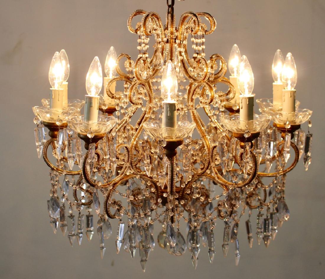 Elegant Crystal Chandelier: Very elegant ten light crystal chandelier, dripping all over with cut crystals and beaded crystal festoons, curled arms are highlighted by attached crystal beads, 20" h, 20" diameter.