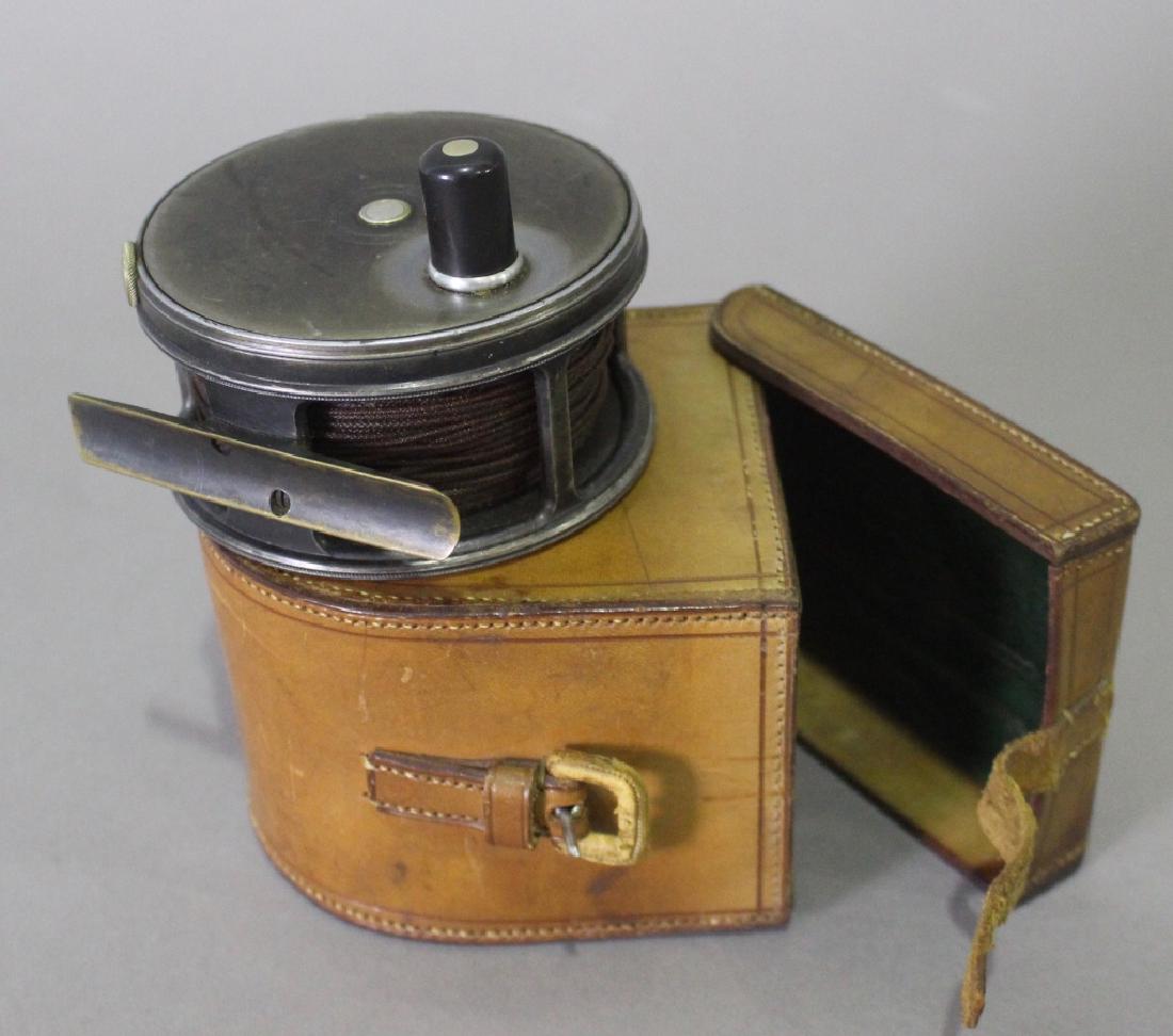 Hardy Bros. Ltd. "The Perfect Fly Reel": Hardy Bros. Ltd., Alnwick, England, "The Perfect Fly Reel", 4" diameter, 2" wide, with custom fitted leather stitched case, spool of braided line, good condition.