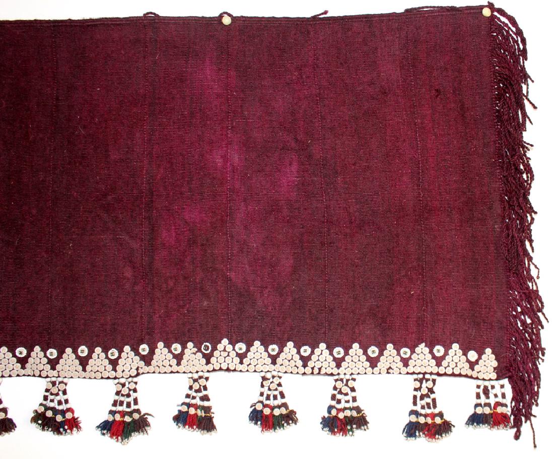 Saudi Arabian Bedouin Tent Hanging: Saudi Arabian Bedouin "tent hanging", 136" wide, 29" long, dyed woven camel hair with sewn decorative buttons and beaded tassels, good condition.