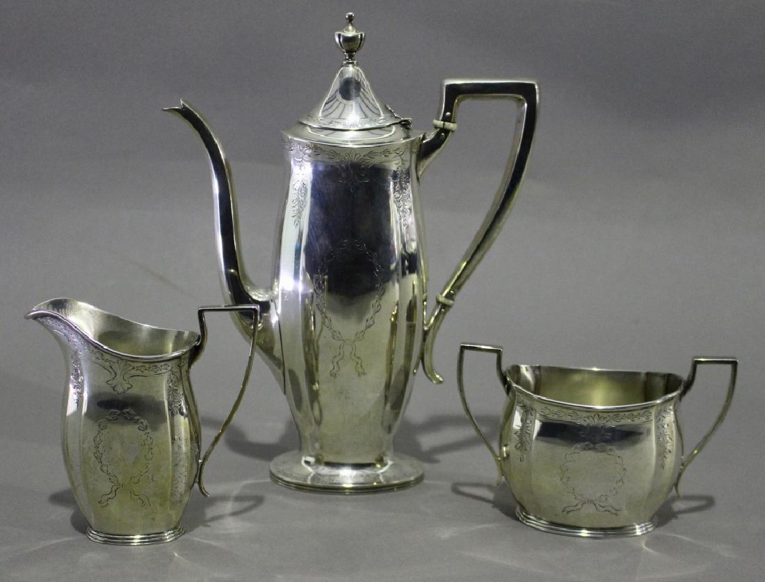 Bigelow and Kennard Sterling Demitasse Set: Bigelow and Kennard 3 piece sterling silver demitasse service, etched design on each piece, coffee pot 9.75" tall, very good condition, c. 1910, 24.4 ozt.