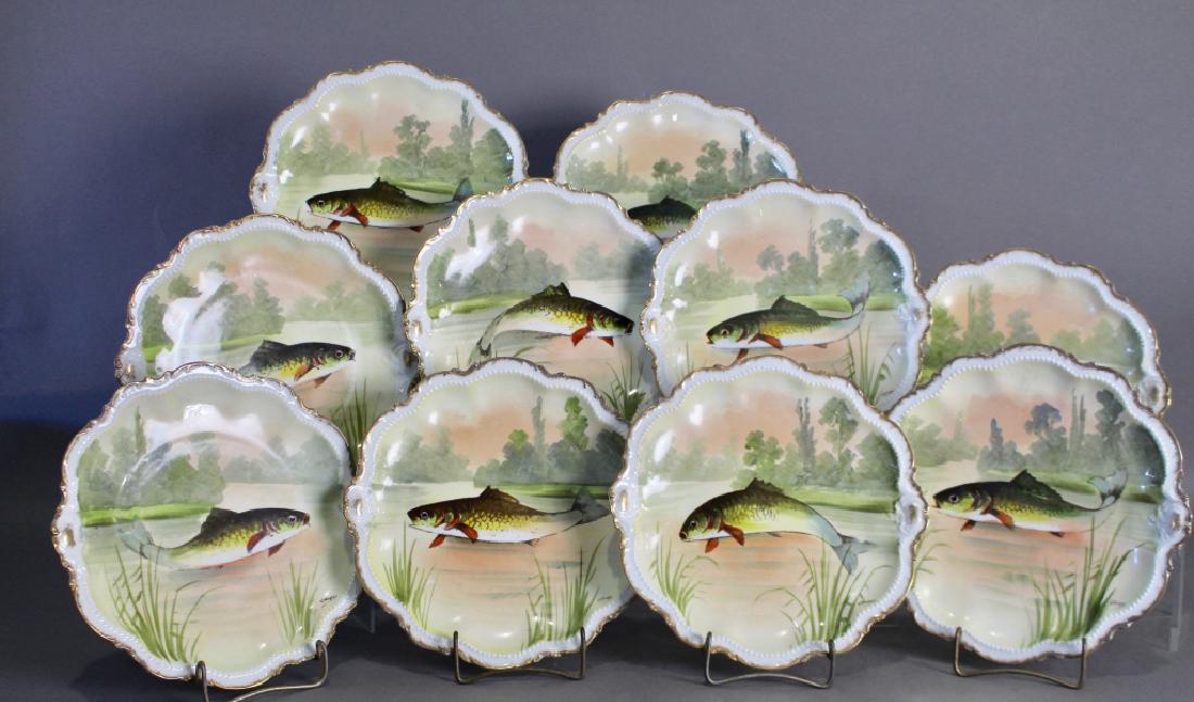 Ten Limoges Hand Painted Fish Plates: Ten Limoges hand painted fish plates, each uniquely different scenes of leaping trout, artist signed "Laure", 9.5" diameter, good condition with virtually no wear.