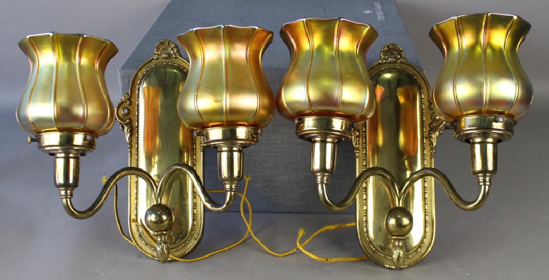 Pair Wall Sconces w/ Quezal Shades: Pair of brass electric light double wall sconces with Quezal shades are signed on collars in beautiful gold iridescent color 4.5", all in good condition, sconces 10" x 5" x 5".