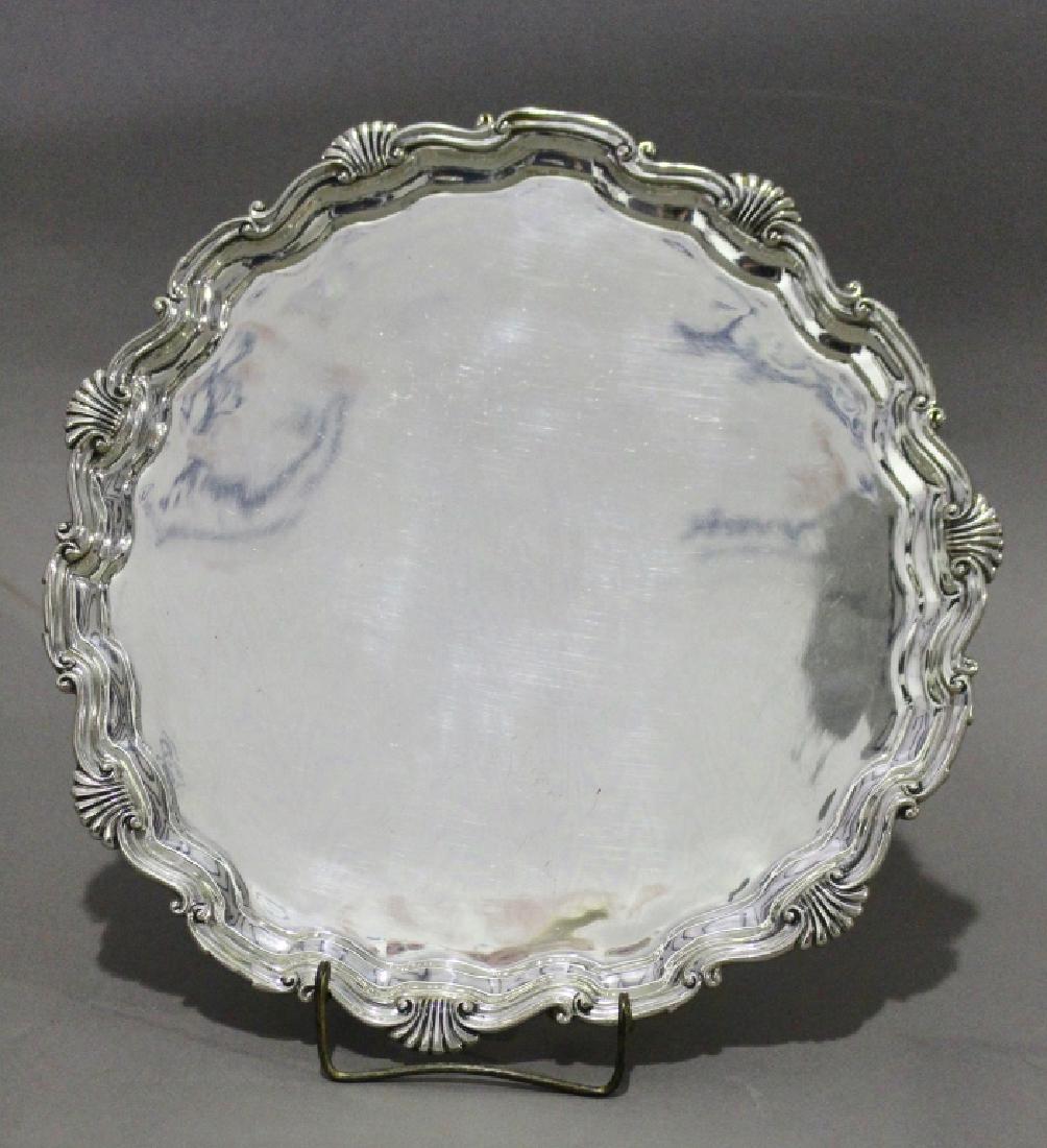 Southern Made Sterling Salver: William De Matteo Studio, Alexandria, VA. hand wrought sterling silver salver, Chippendale design, dated 1969, very good condition with normal minor surface scratches, 12" diameter, 25.32 ozt.