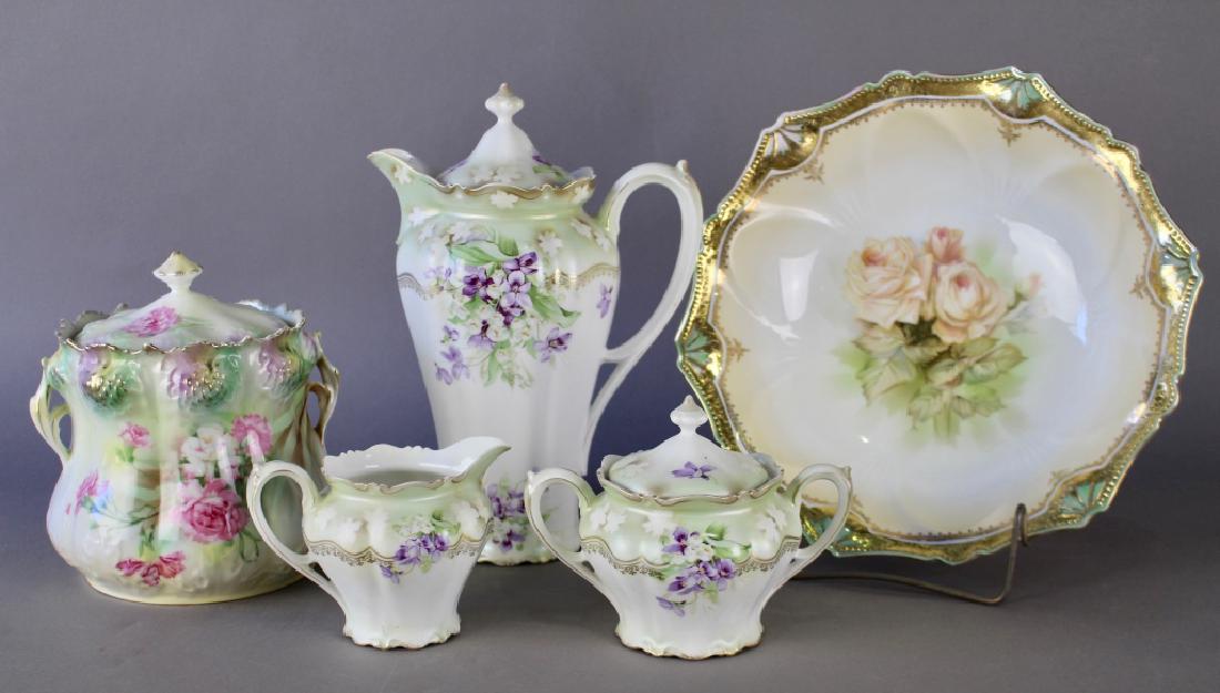 R.S. Prussia Group: R.S. Prussia group to include a three piece chocolate pot with creamer and sugar bowl, a fine bowl with gold trim and a cracker jar with handles, blown out thistle border, all in good condition.