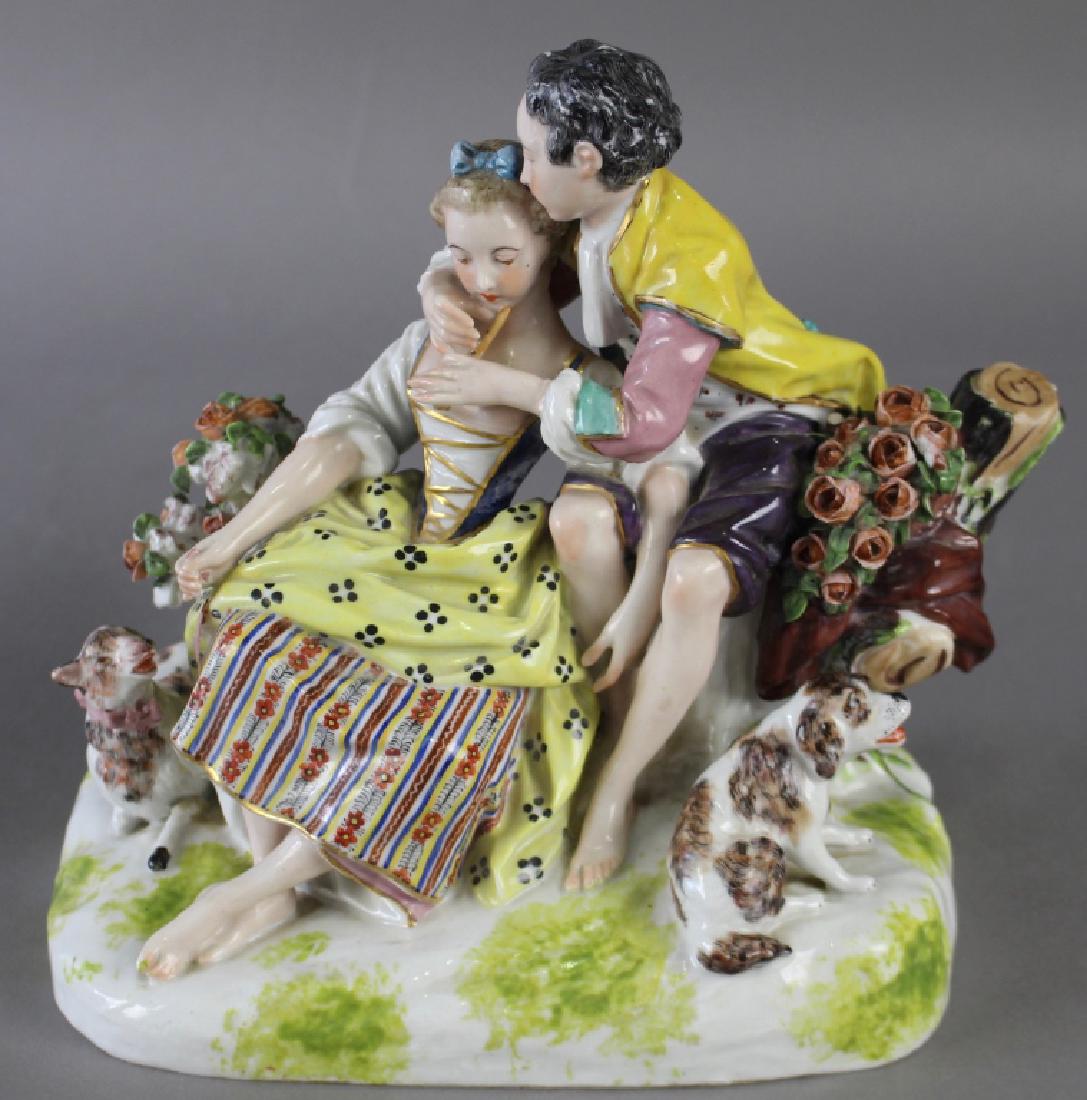 Late 18th Century Meissen Grouping: Late 18th century double Meissen figural grouping, depiction of young man courting a young lady, he with his dog, she with a lamb on a tether (partially missing) a couple of nicks on flowers, his flut