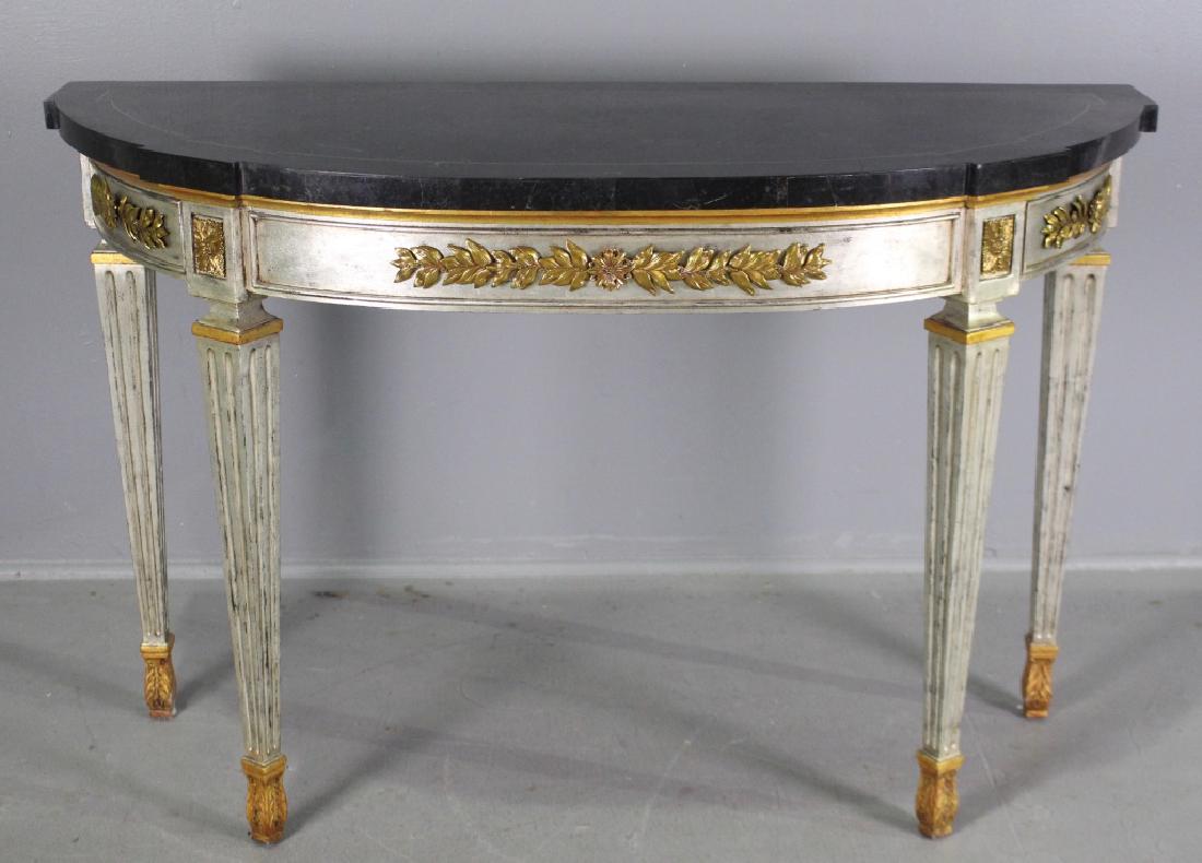 Baker Furniture Demilune Console Table: Baker Furniture Co. Neo-Classical demilune console table, black faux marble parquetry top, silver leaf with gold highlights, applied gold laurel wreath to curved panels, reeded tapered legs ending in 