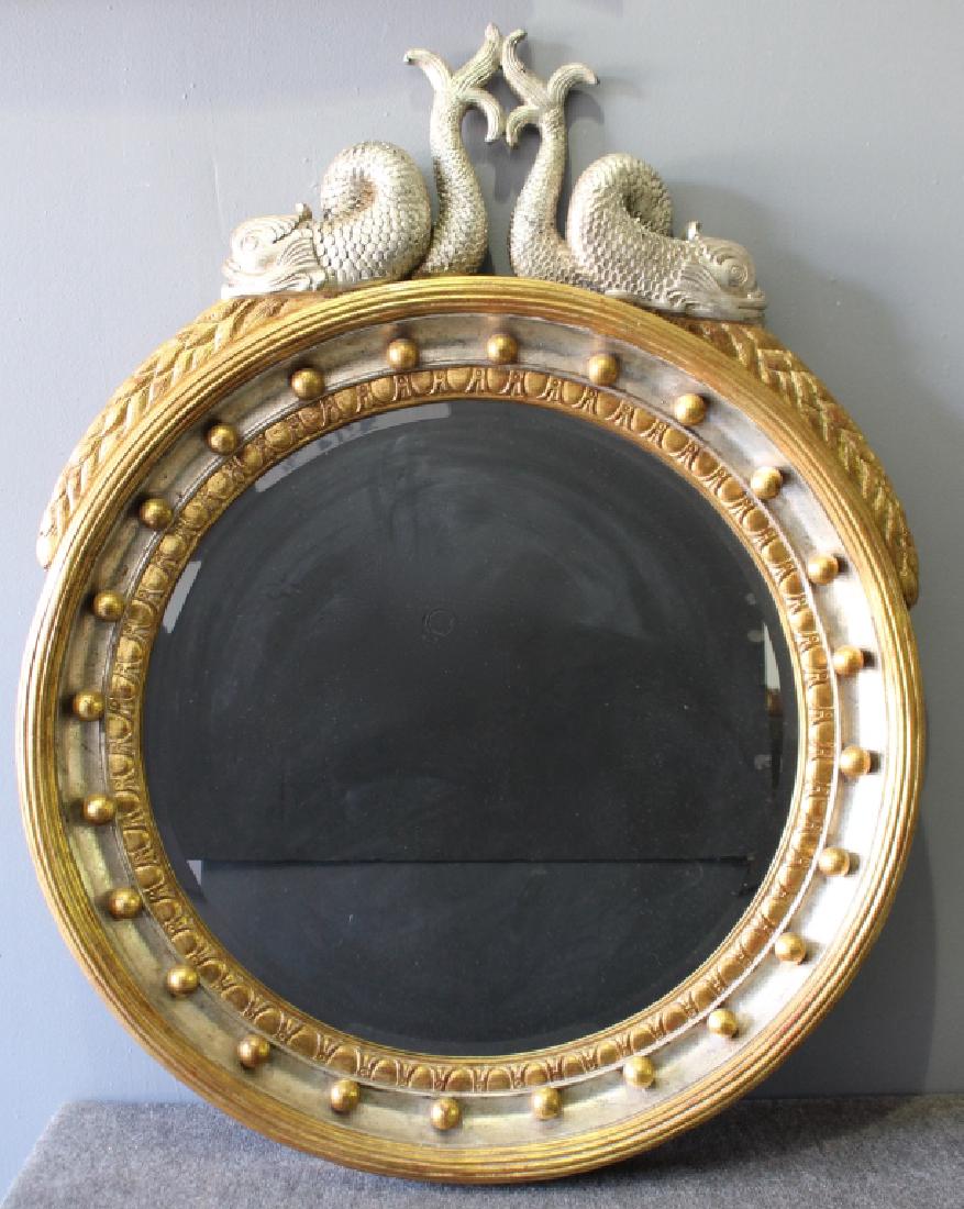 Contemporary Dolphin Theme Mirror: Contemporary round mirror with dolphin crest, silver and gold leaf paint on composition wood, 40" round frame, beveled glass surrounded by gold orbs, very heavy 62 pounds, good condition, one tip end 