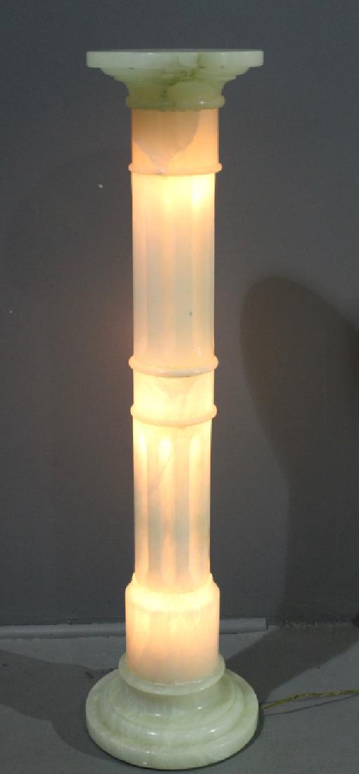 White Marble Pedestal with Interior Light: White marble pedestal with interior lighting. Three bulbs enhance glow of pedestal, 43" tall, 9" diameter top, good condition.