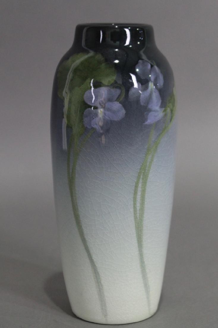 Rookwood Iris Vase by Ed Diers: dated 1903, shape #907, purple violets on long green tendrils, light crazing, 8.5", good condition.