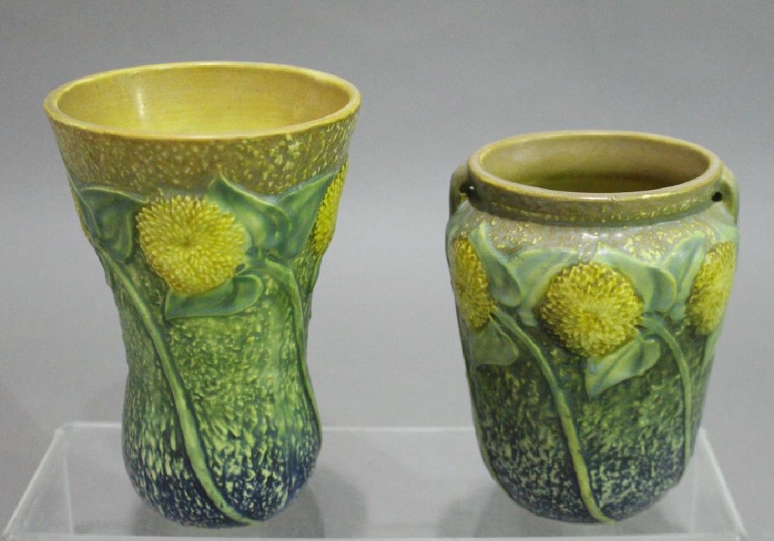 Two Piece Group Roseville: in the Sunflower pattern c. 1930: #487-7 and a 6" uncataloged vase, both mint with clean crisp molds.