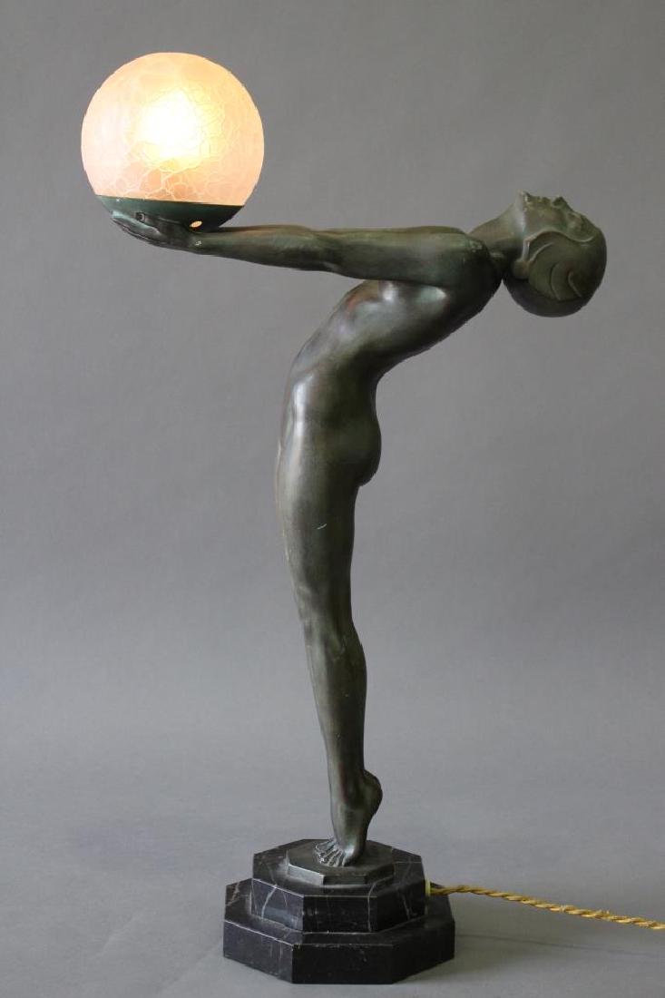 Max LeVerrier, 1891-1973, French Art Deco Lamp: Art Deco patinated bronze nude, c. 1925, "La Clarte" she holds a crackle frosted glass round globe in her outstretched arms, her head tilted back, and she stands on two tier black marble base, 24" tal