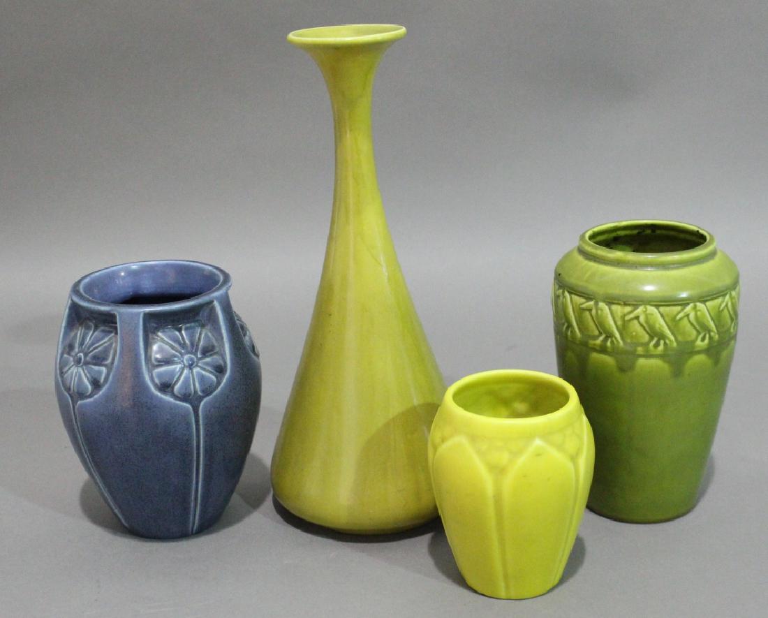 Rookwood Pottery Group of 4: pieces of mat glaze commercial ware: Green 1921 7" vase with rook border, 1931 6.5" blue vase with panels of stylized flower border and rim supports, 1932 4.5" yellow glaze vase, and 1920 12" yellow m