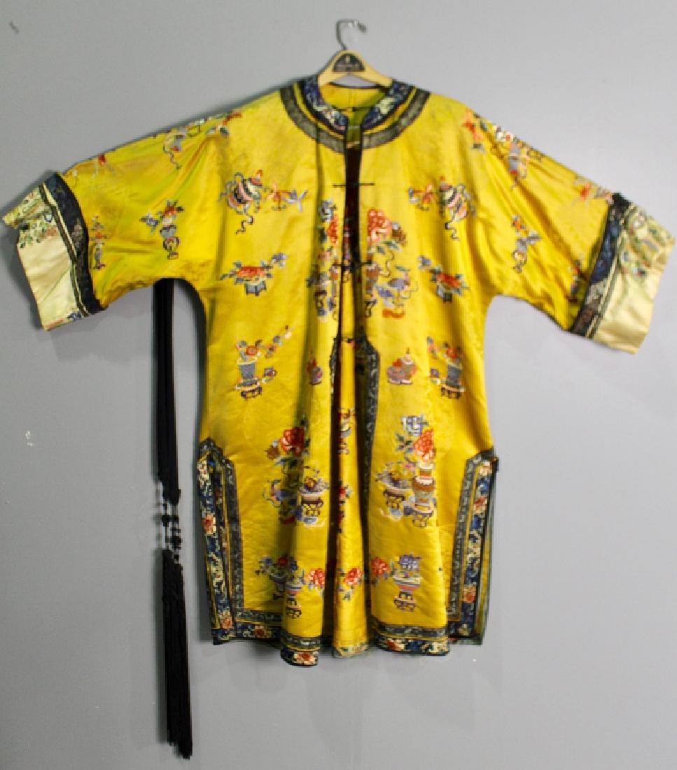 Chinese Silk Embroidered Robe: late 19th century, Imperial gold with elaborate needlework all over, some very minor damage to sleeve area, lining missing, sleeves 27" to middle of collar, 47" long, rare to find accompanying black t