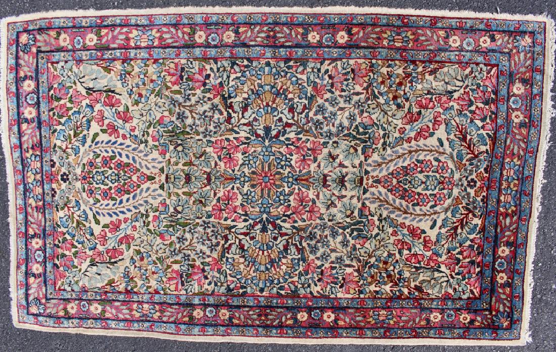 Semi-Antique Ishfahan Rug 35.5" x 58": c. 1940s, tight weave, neutral background, 3 borders with two and floral borders enclosing a burgundy floral border, Persian fabric label, good condition with some edge fraying.