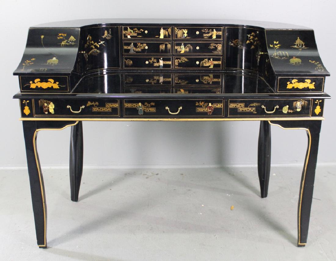 Chinese Black Lacquered Writing Desk: decorated in the style of a Dickens desk, ample storage and drawers surround top three fourths of surface, then 3-drawers in front, gold trimmed edges and legs, good condition with minor wear and scra