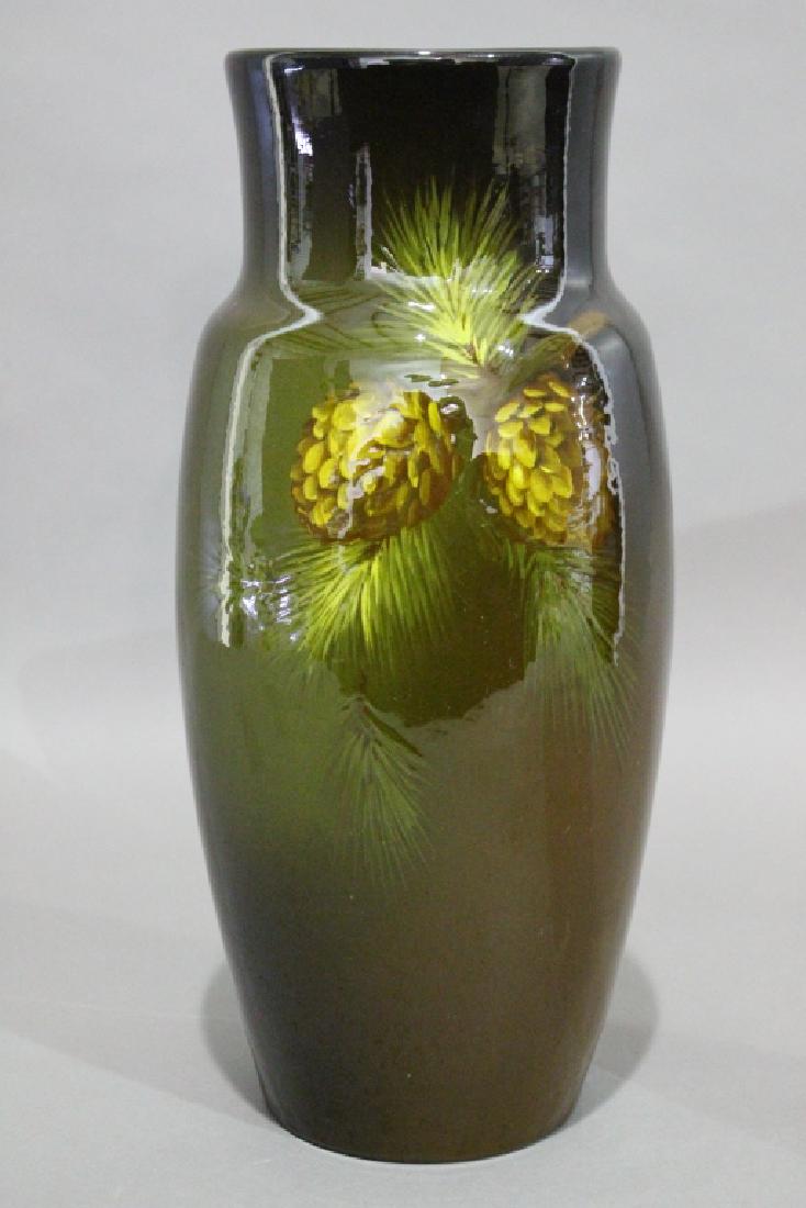 Large 15" Owens Pottery "Utopian" Vase: standard brown glaze with pinecones and needles slip under glaze decoration, impressed "Owens 215" on bottom, minor crazing, good condition.