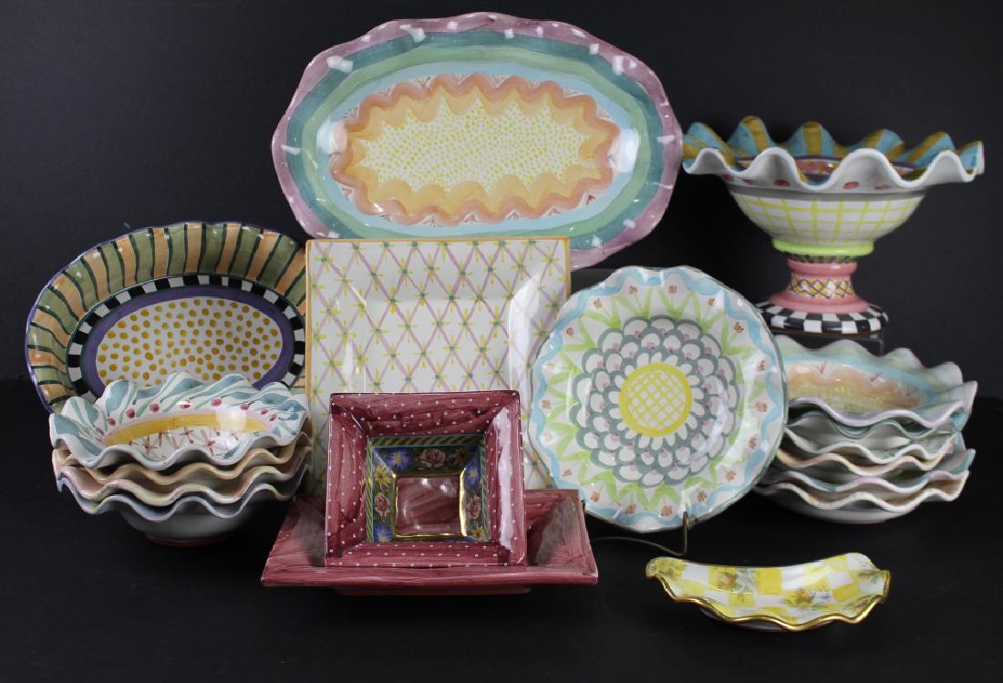 Large Group of Mackenzie Childs (18 Pieces): hand painted terra cotta pottery in the distinct style of Mackenzie Childs: 12" x 8" pedestal bowl, 13" oval bowl, 16" oval platter, 7-9.25" shallow bowls, 4-8.5" deep bowls, 9.5" x 7" rectangle tray,