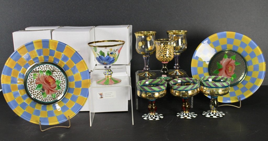 Mackenzie Childs Hand Painted Stemware: 2-6.25" goblets, 5.5" goblet, 3-5" stemmed desserts, 12-5" Flower Market sorbet glasses (11 in unopened boxes), 2-11" Full Bloom dinner plates, all in excellent condition.