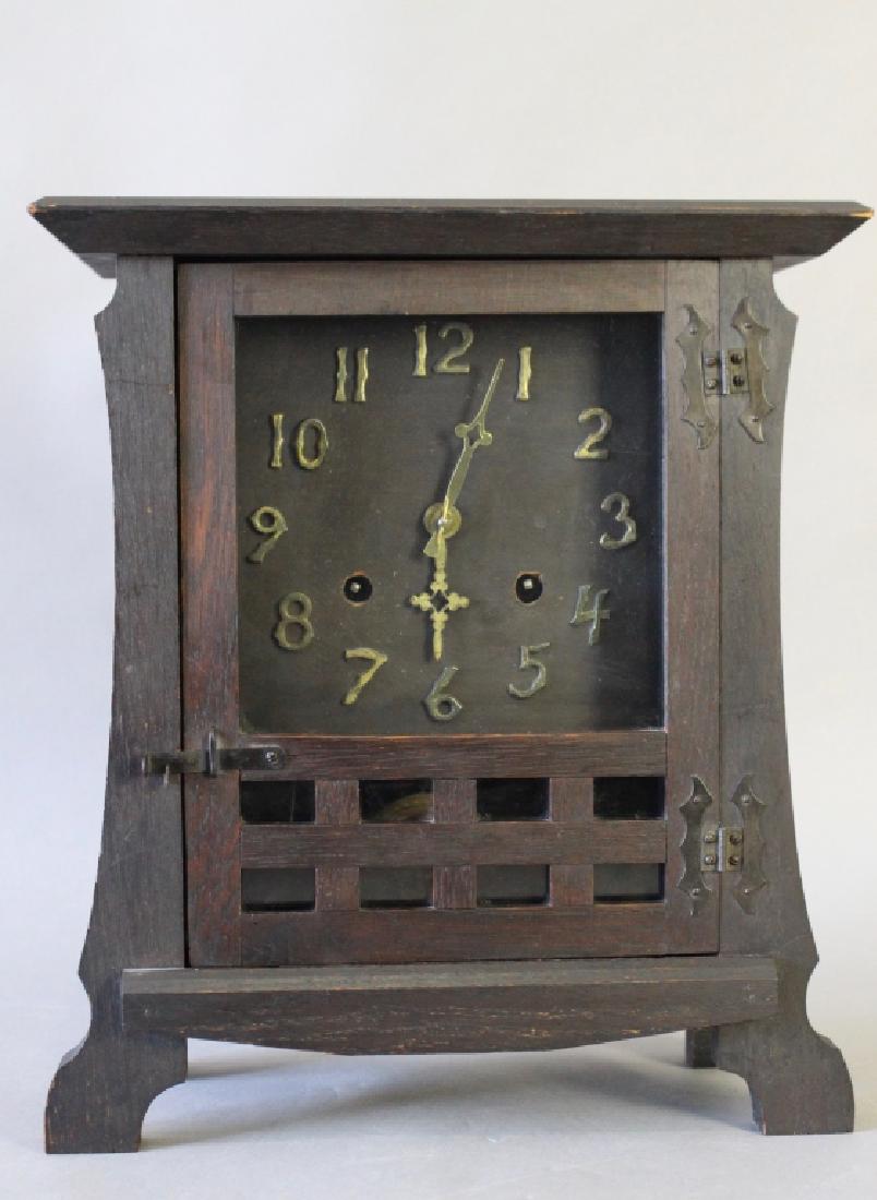 New Haven Mantle Clock: in Mission Oak case, c. 1912, runs well, chimes on quarter hour as well, paper label on back, 14" x 12" x 6".