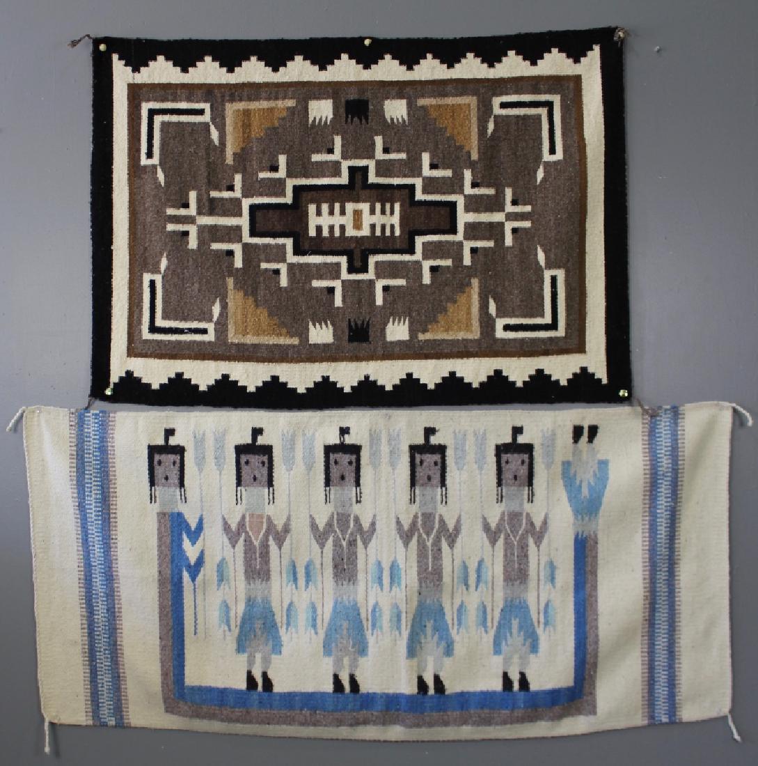 Two Southwest Native American Blankets: hand woven wool, both in very good condition. 45" x 30.5" geometric blanket, black border with gray, white and brown interior, and a Yei rug 60" x 28" with 5 figures in light blue, black and gray on m