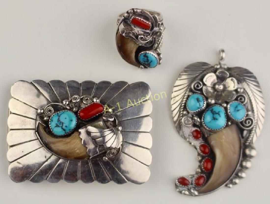 Southwest Native American Jewelry (3): a 2" x 3" sterling belt buckle signed D. Delgarito with bear claw, turquoise and coral. An ornate sterling ring with bear claw, coral and turquoise, size 9, signed SC and a pendant with coral, bear cl