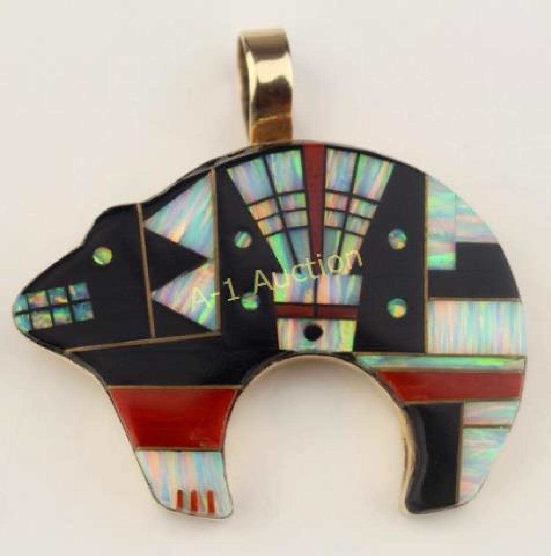 14K Zuni Spirit Bear Pendant: Native American, artist signed "SG", inlay of onyx, coral, iridescent mother of pearl, set in yellow gold, 2" x 2".