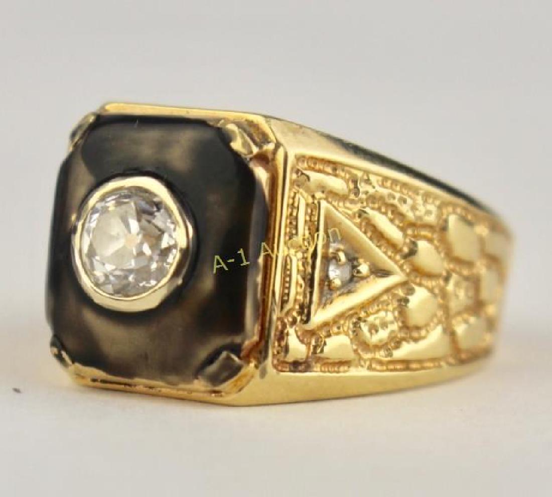 14k Gold Man's Diamond Ring: round center diamond approximately .33, 2 small diamonds imbedded on sides, size 8.5, 9.7 grams, good condition.