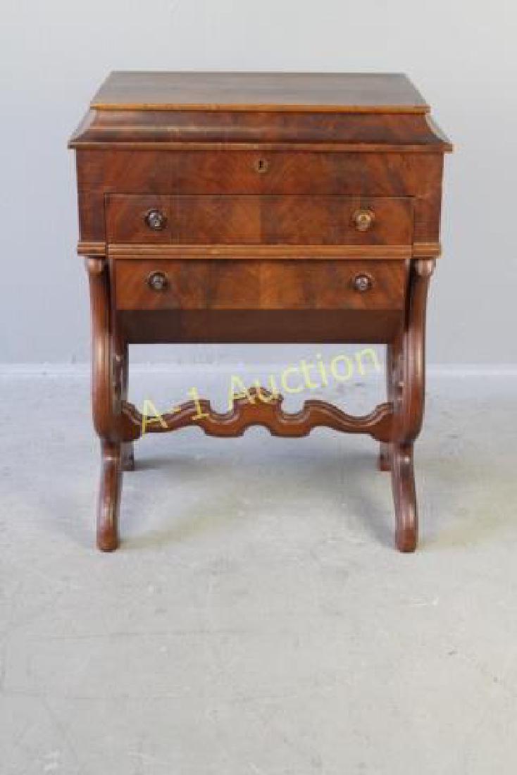 Empire Period Mahogany Sewing Table: grain top, lifts to reveal compartments full of notions, mirror inset, single drawer, then a yarn storage drawer, finger carved legs and stretcher, fairly rare, no harm age split in top, 29.5" x 22" x