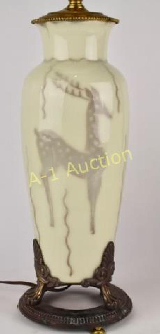Rookwood Pottery Table Lamp: mid-century decorated, Elizabeth Barrett (wife of Jens Jenson), dated 1948, shape 2785, with stylized deer on cream glazed background typical hardware and base, in fine condition, 25" overall height.