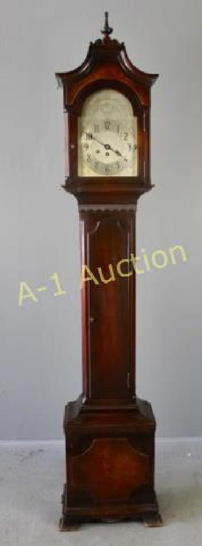 Herschede Grandmother Clock, c. 1925: mahogany case with bird's eye maple accents, Westminster and Canterbury chimes, Model 10, 72" tall x 14" w x 10" d, good working condition.