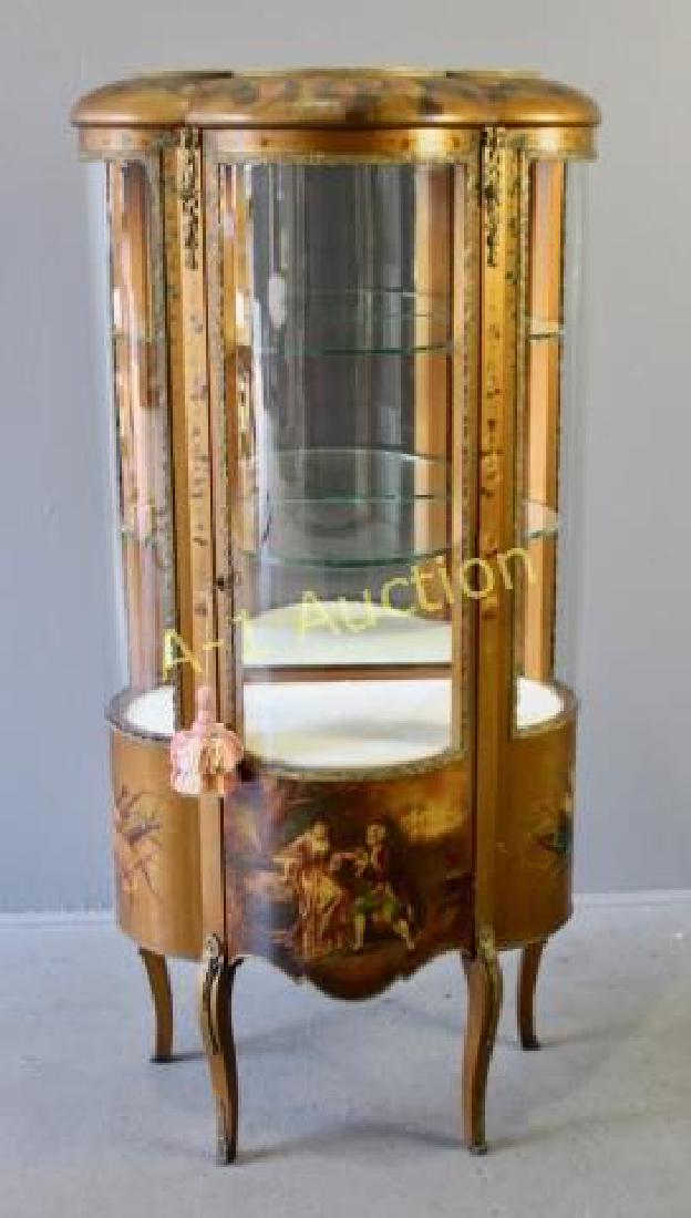 French Bow Glass Curio Cabinet: early 20th century, three panels of original curved glass, applied ormolu on legs, door and around glass, hand painted Classical scene of courting couple, florals and musical instruments on curved pan