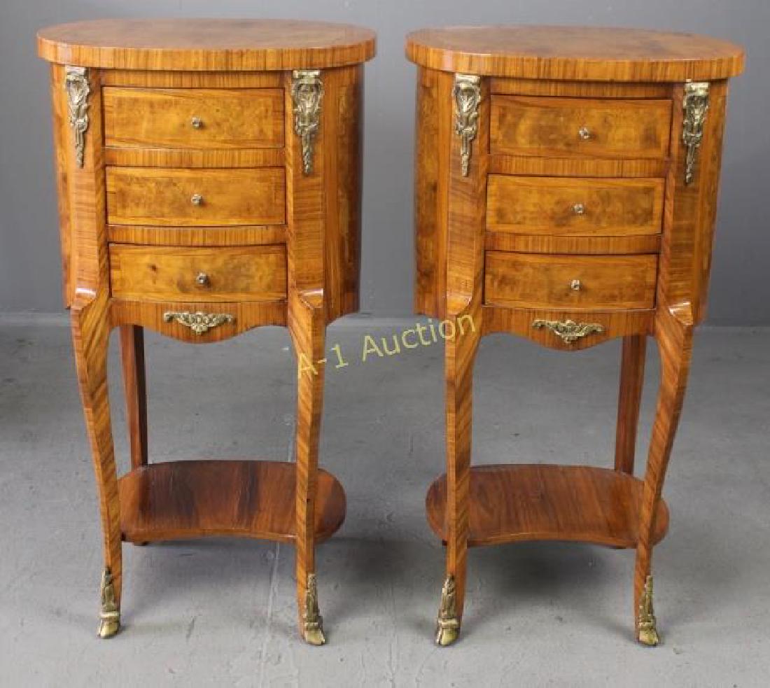 Pair Continental End Tables: in burled veneer, 3 drawers each on oval shaped body, bronze ormolu embellishments, very good condition, 32" x 17" x 12".