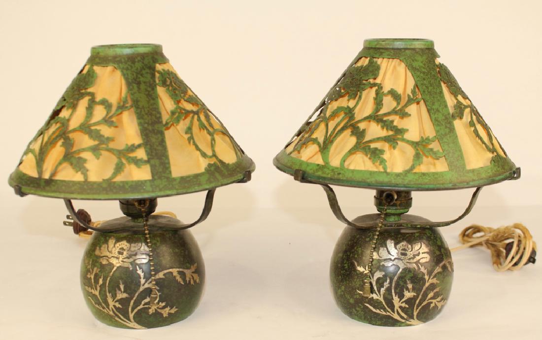 Pair Heintz Metal Art Lamps: matched pair boudoir lamps, Buffalo, NY, c. 1910-12, green patinated bronze with sterling overlay decoration, silk fabric lined reticulated shades, pull chain sockets, foil factory label on one, 10" t