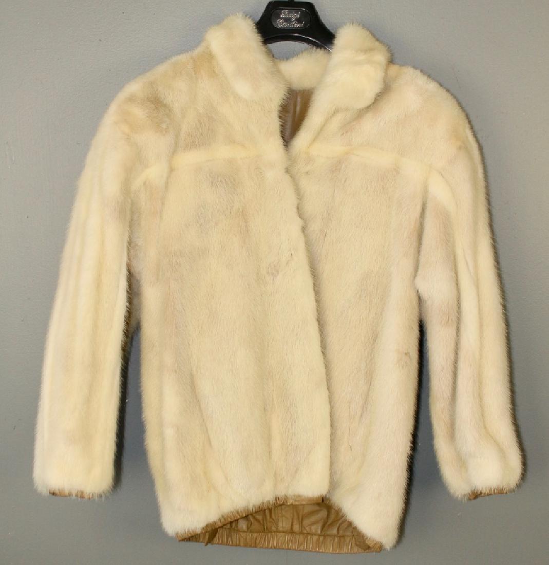 White Mink Reversible Jacket: tan leather lining that turns inside out for a versatile fashion form, 24" sleeves, 28" long, medium size.