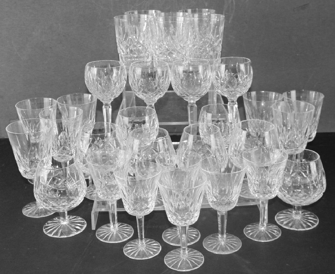 Waterford Crystal Stemware and Glasses 31: Lismore pattern; 7-7" water glasses, 6-7.25" balloon hocks, 6-5.75" wine glasses, 6-5" brandy snifters, 6-4.5" tumblers, all in good condition with no defects. 31 pieces total.