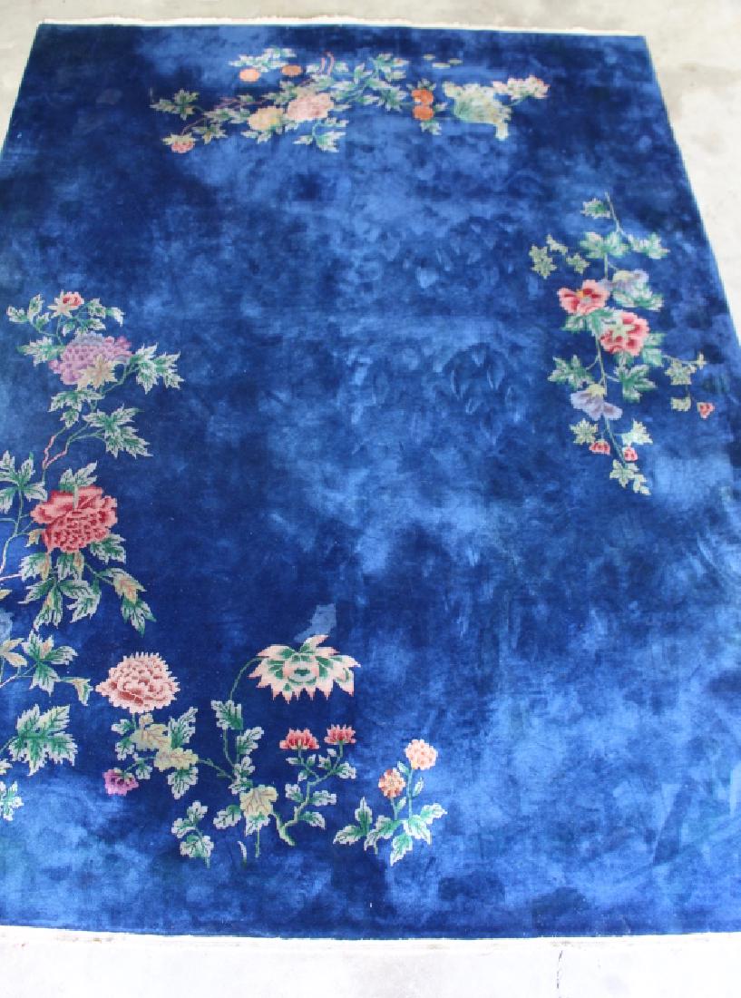 Chinese Nichols Rug 11.6' x 8.8': stunning blue with floral around border that compliment the thick wool pile, good condition.