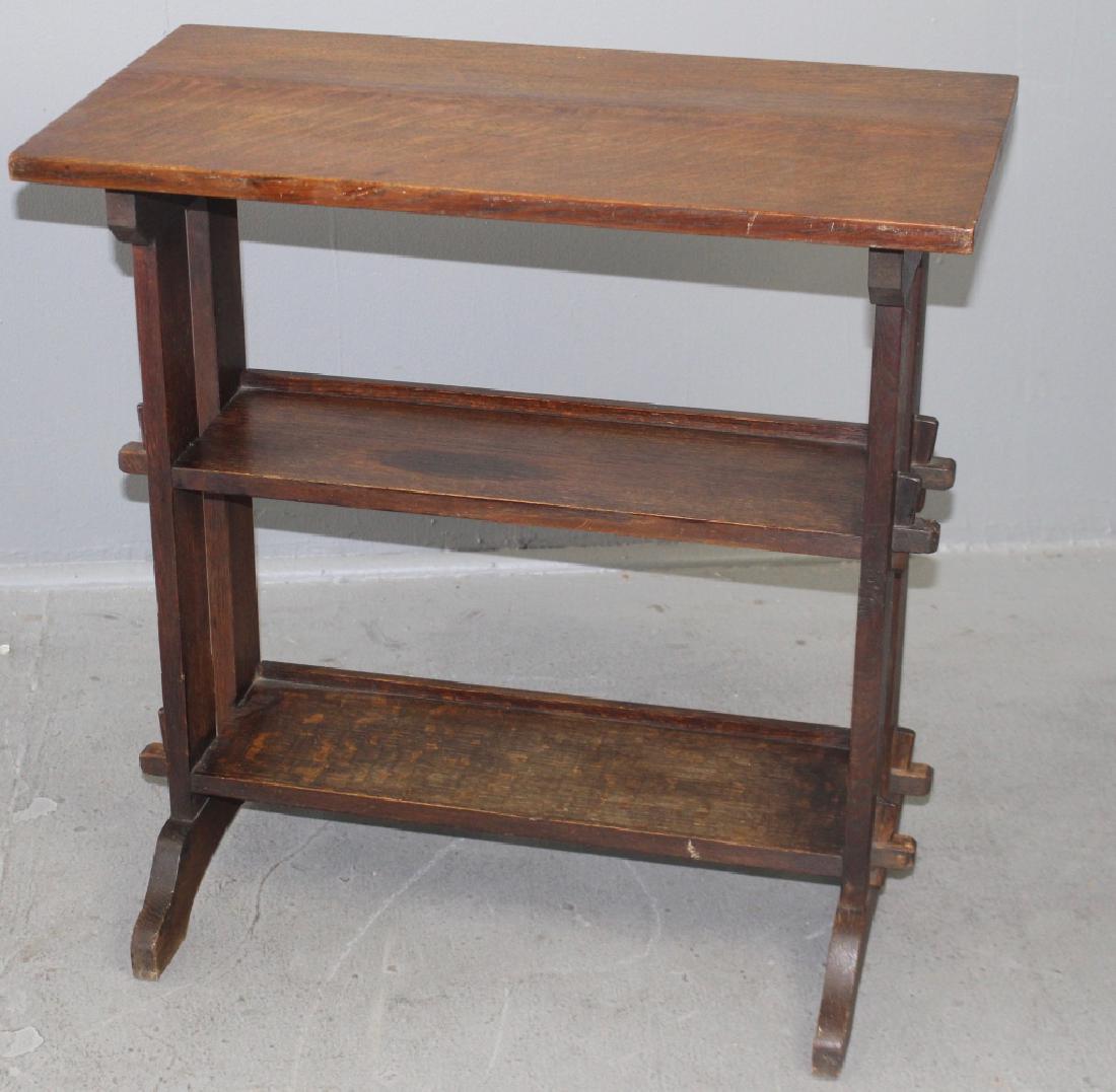 Roycroft Arts and Crafts Bookstand: 3 tiers, through tenon joinery, evidence of where oval Roycroft metal tag used to be, finish not original but good. 26" x 14" x 26.5".