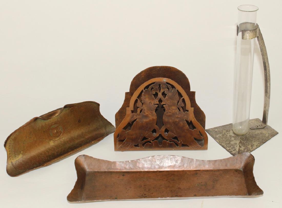 Arts and Crafts Metal Group: Gustav Stickley 10" pen tray marked "Als lk Kan", Roycroft 7" fold over pen tray with embossed owl, a Roycroft silver wash test tube bud vase and an unmarked copper letter holder with cut out parrots,