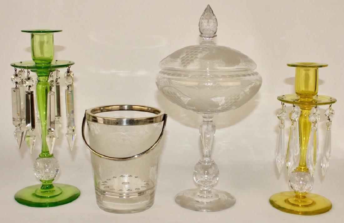 Four Pieces Pairpoint Glass: etched crystal compote with controlled bubble finial and ball stem, 12" tall. Green 11" candlestick with prisms, yellow 9" controlled bubble candlestick, and etched ice bucket 6" with silver bail, all