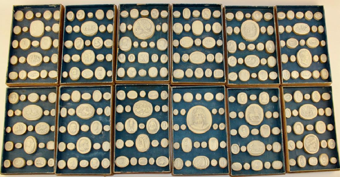 Collection Roman Empire Seals and Cameos: 19th century re-cast in white clay. In 12 display trays, each is oval or round and depicts heroic scenes, profiles of dignitaries, and animals. Each are numbered and probably had a guide identifying e