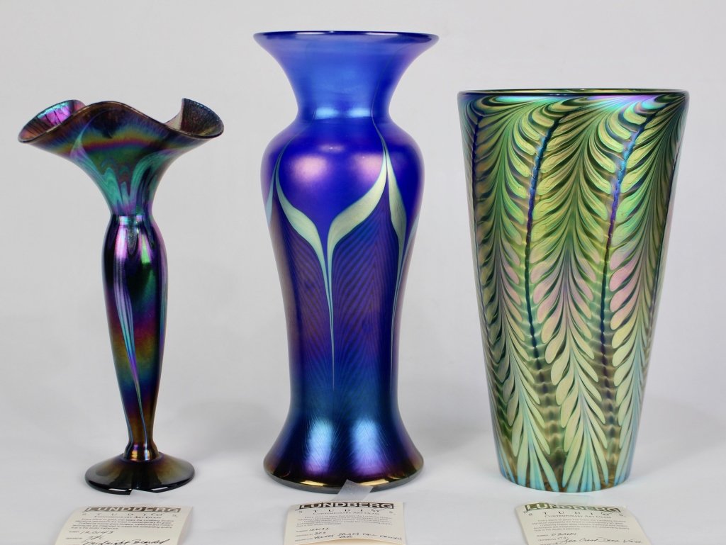 Three Lundberg Studios Art Glass Vases: 10.75" Sea Crest Deco vase no, 032601, 10.5" Midnight Bearded Petite Corset vase, no. 120143 and 12" Velvet Splash Tall French vase, no. 120122, all mint, all signed with studio paperwork included.