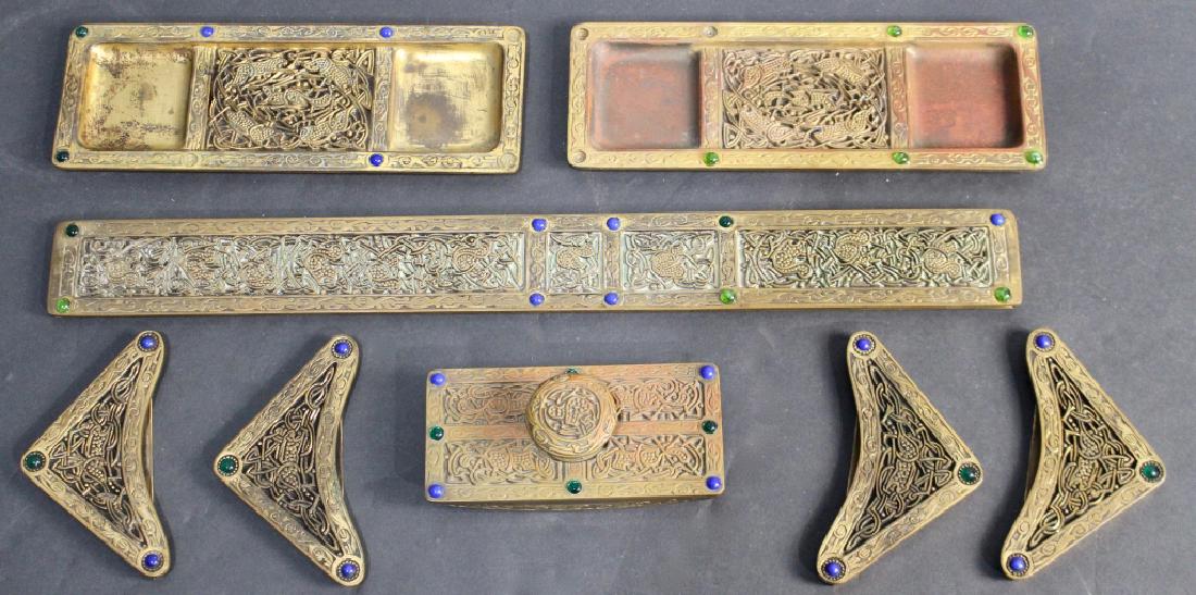 Tiffany Studios Desk Pieces - Ninth Century: eight pieces includes 4 blotter corners, ink blotter, 2 ink stand trays and a blotter side, cabochons missing on ink trays, most pieces signed.