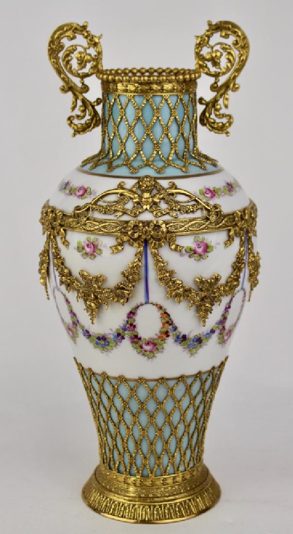 Chateau de Chinon Porcelain Vase: hand painted with elaborate gold metal ormolu covering the body with handles, full signature with 5-point crown over "S" under glaze, 12" high, very good condition.