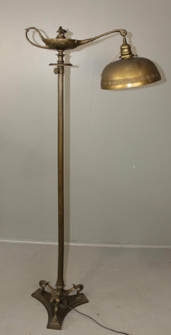 Tiffany Studios Aladdin Floor Lamp: Dore bronze shade, signed, ornate cement filled base, signed, reeded shaft slightly bent, all original except wiring, dark patina, cupid finial, 54" tall.