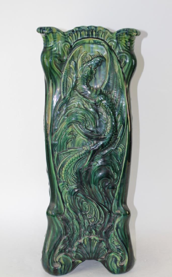 RARE Weller Pottery Umbrella Stand: this piece is pictured in the book, "The Rare, The Unusual, The Seldom Seen Weller Pottery", green high glaze with dragon motif panels, c. 1900-05, unsigned, very good condition, 26" h x 10.5" square.